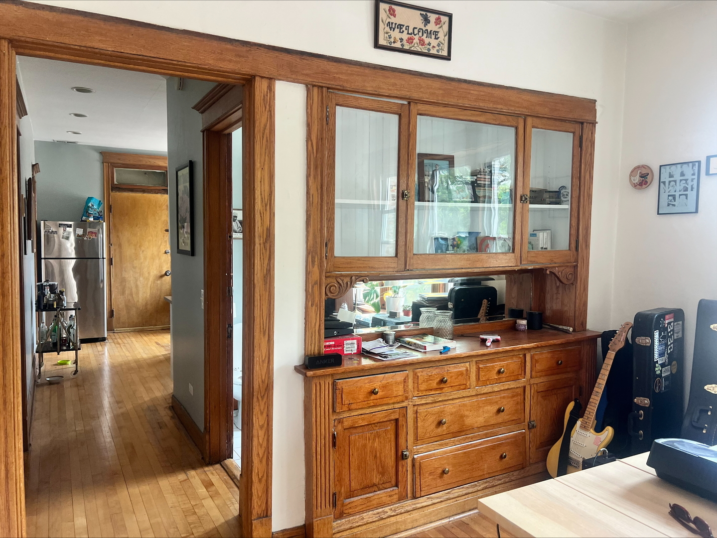 3330 West Evergreen Avenue Chicago, IL 60651 - Photo 4 of 16 a hallway with a view of living room and wooden floor