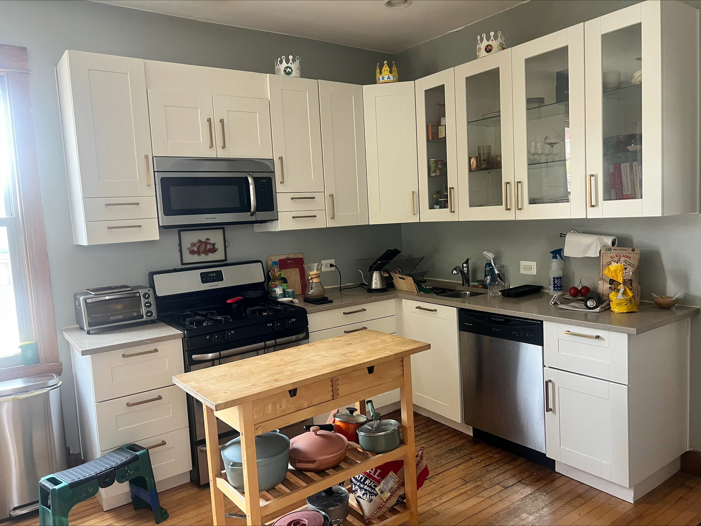 3330 West Evergreen Avenue Chicago, IL 60651 - Photo 6 of 16 a kitchen with a sink a stove and cabinets