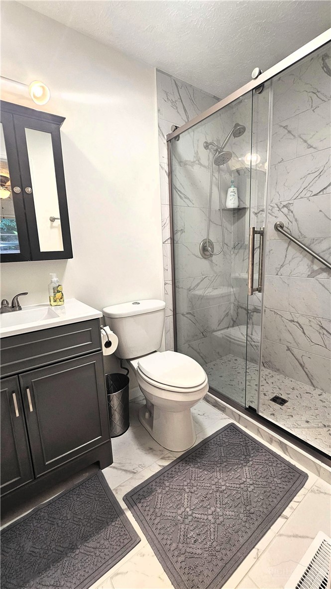 159 Easy Street Boone, NC 28607 - Photo 22 of 46 a bathroom with a toilet sink and shower