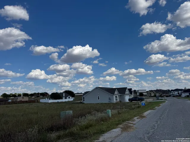 a view of a house with a big yard