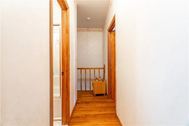 a view of a hallway with a white walls