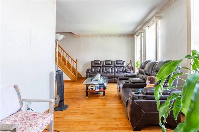 a living room with furniture and a rug
