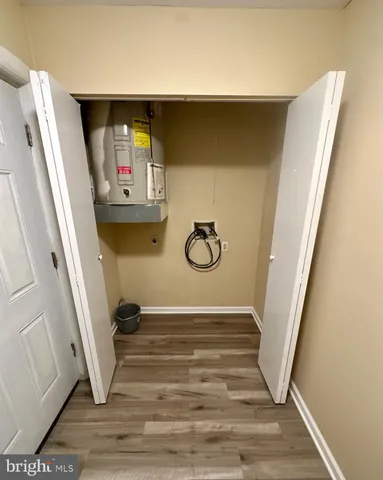 a view of small space with wooden floor and chair