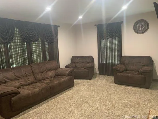a living room with furniture and a couch