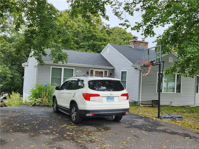 a car parked in front of a house