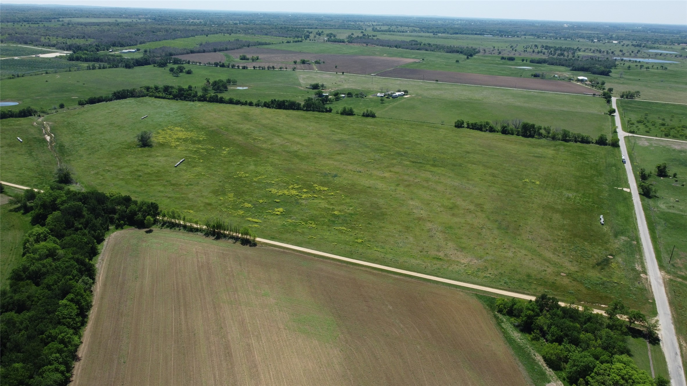 2 County Road 440 Thorndale, TX 76577 - Photo 3 of 29 an aerial view of a houses with outdoor space and a lake view