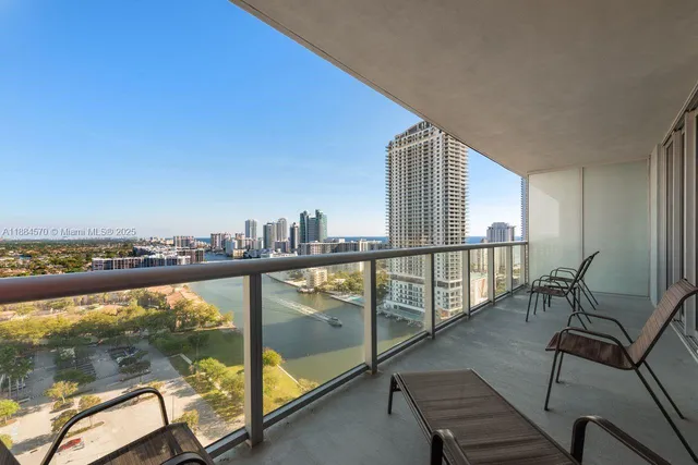 a view of a balcony with chairs