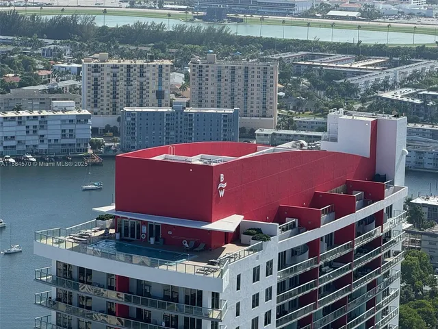 a view of a balcony with a table and chairs