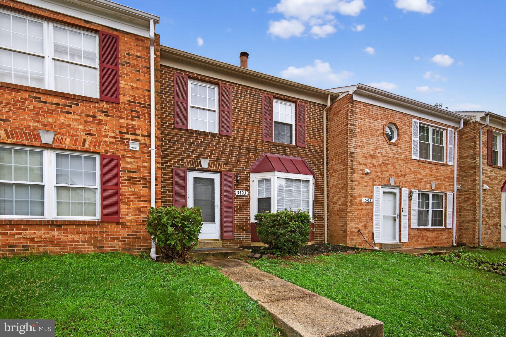 3423 Tendril Court Woodbridge, VA 22192 - Photo 1 of 20 a front view of a house with a garden