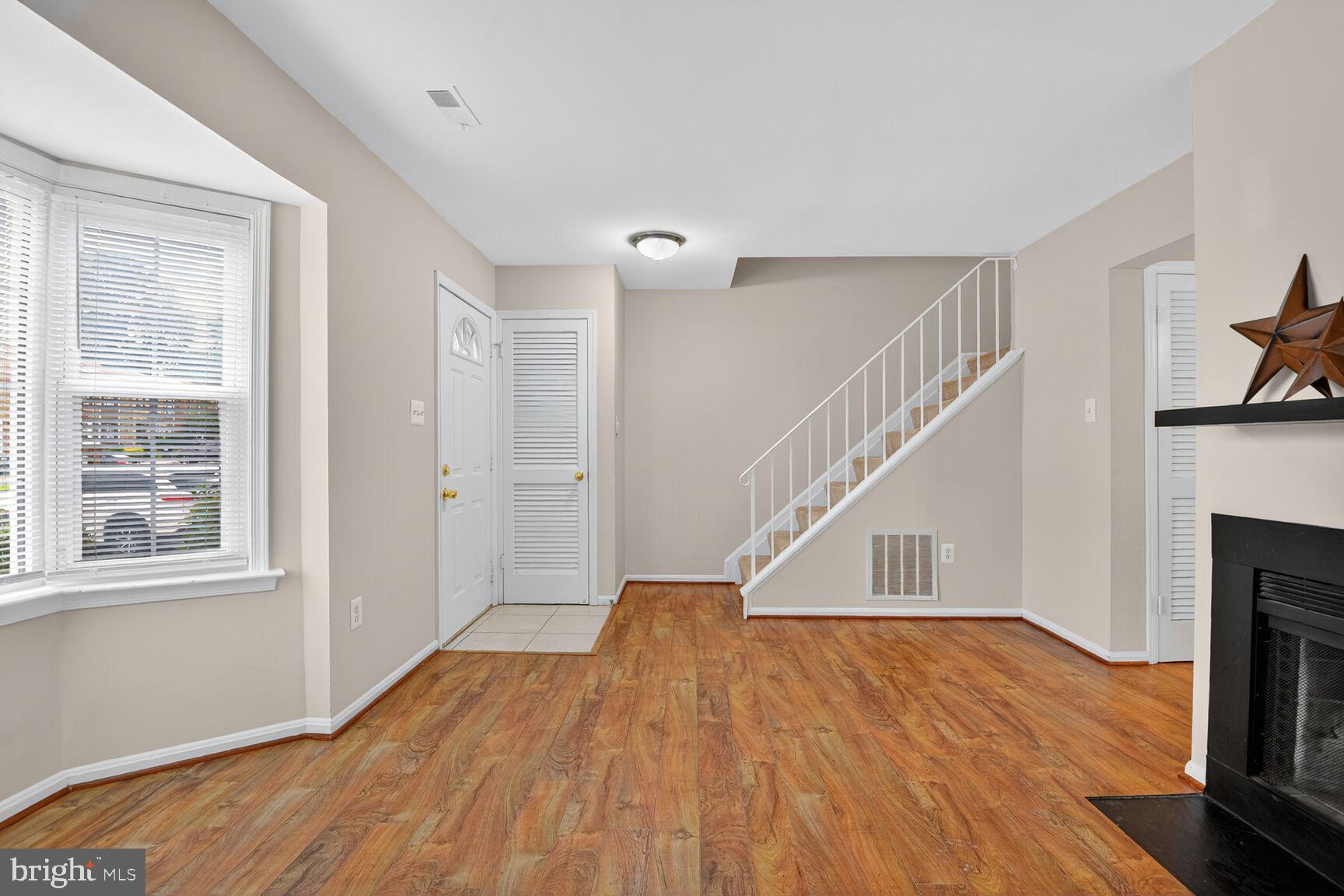 3423 Tendril Court Woodbridge, VA 22192 - Photo 4 of 20 a view of entryway and hall with wooden floor