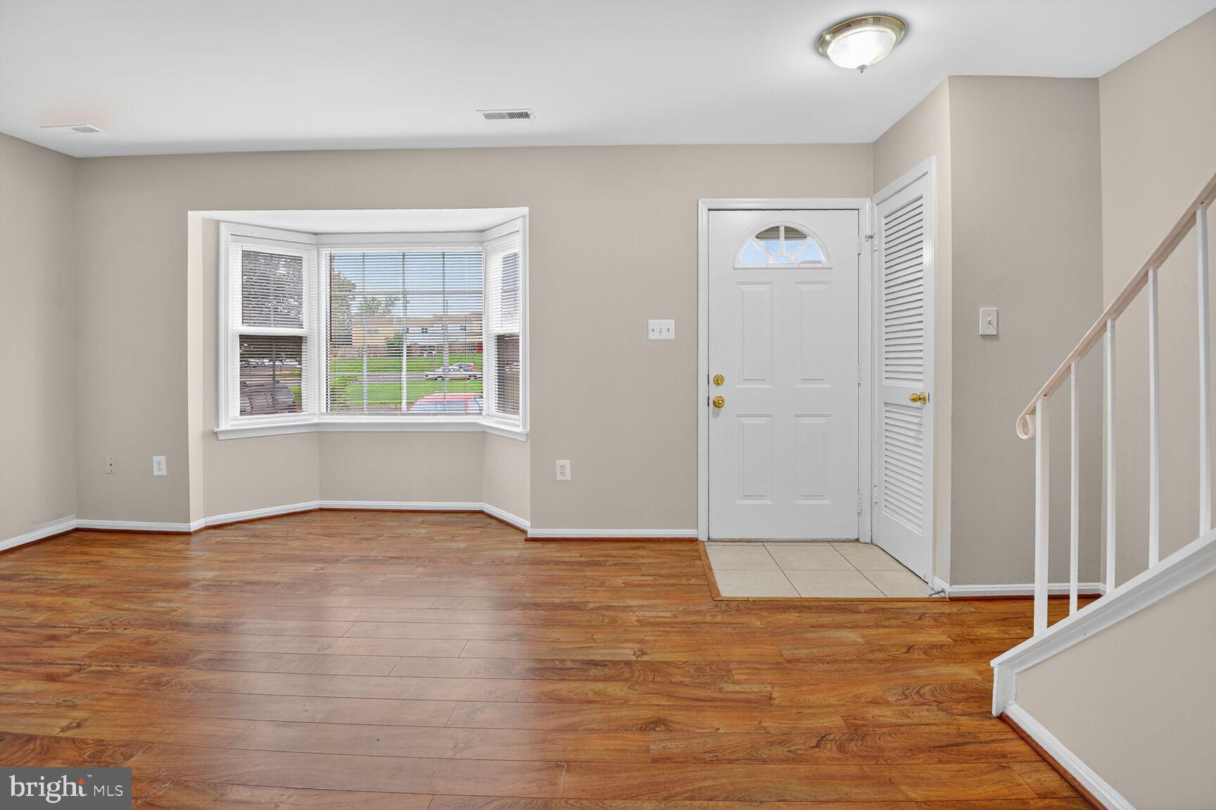 3423 Tendril Court Woodbridge, VA 22192 - Photo 6 of 20 an empty room with wooden floor and windows