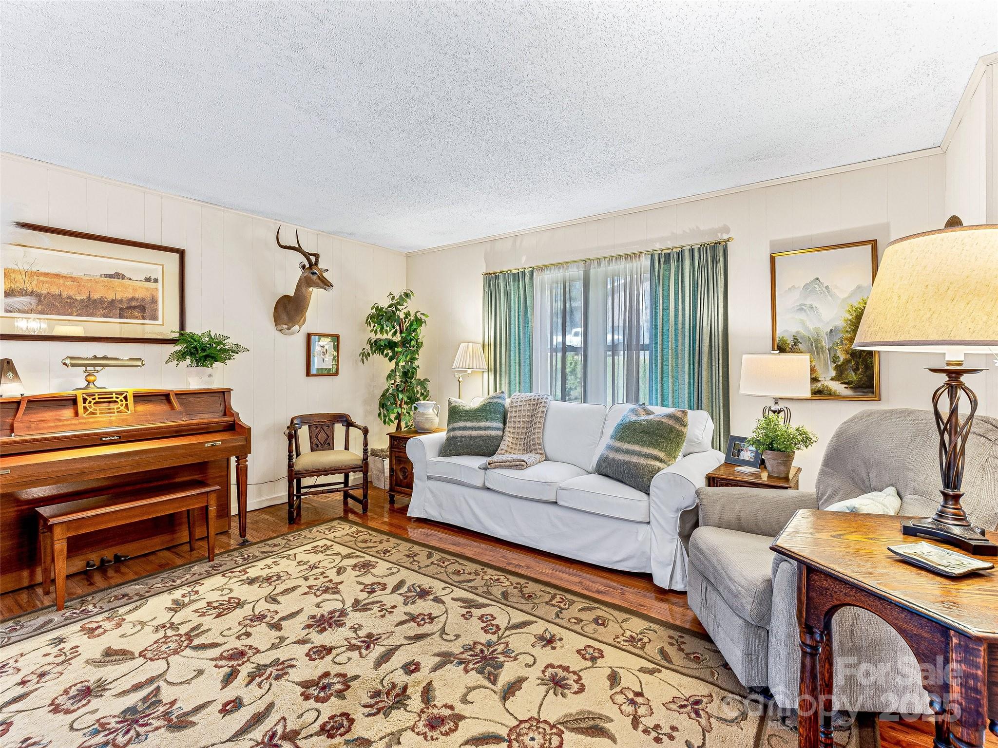 29 Tall Oaks Road Candler, NC 28715 - Photo 11 of 34 a living room with furniture and a window
