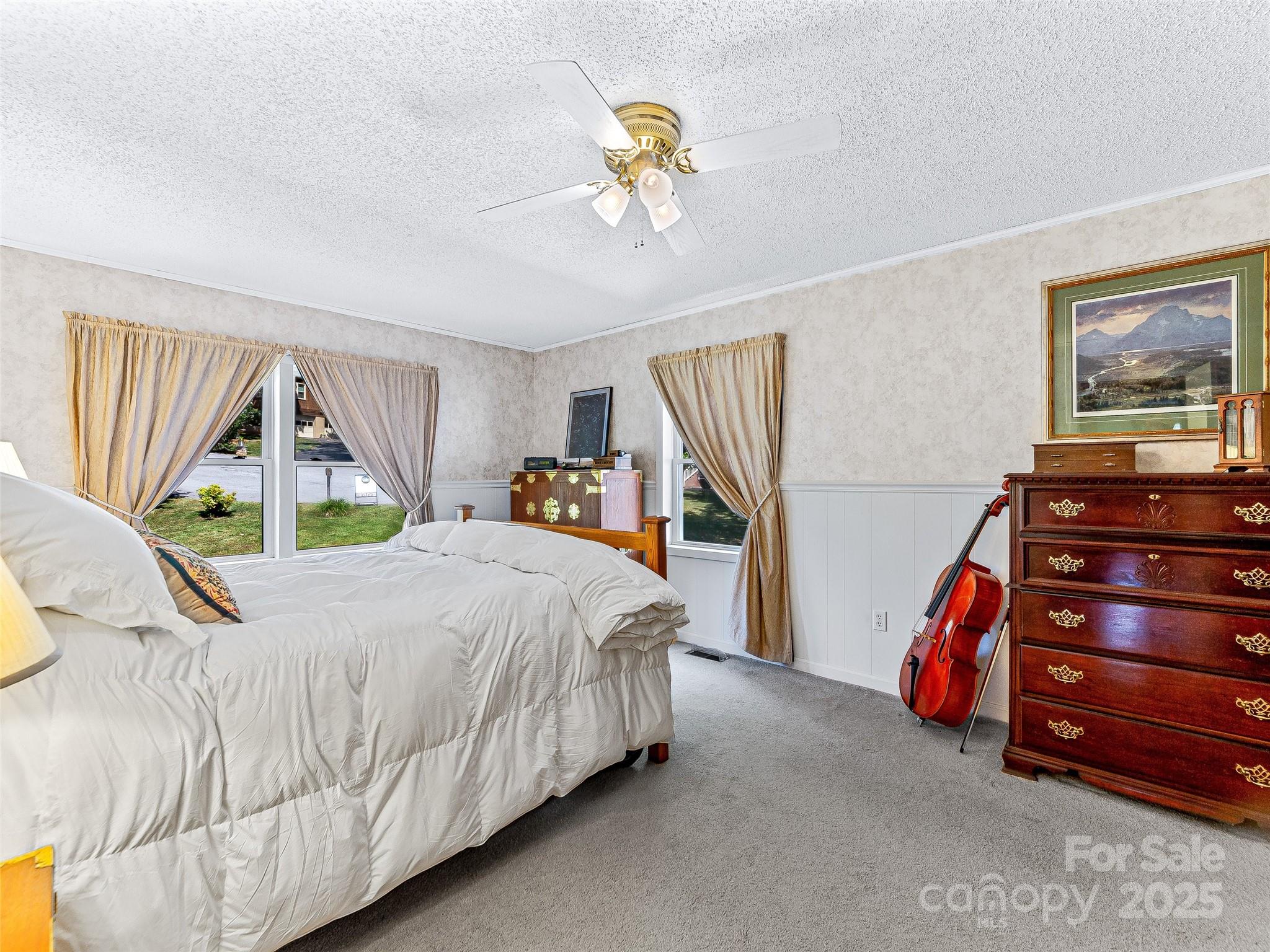 29 Tall Oaks Road Candler, NC 28715 - Photo 14 of 34 a bedroom with a bed and a walk in closet