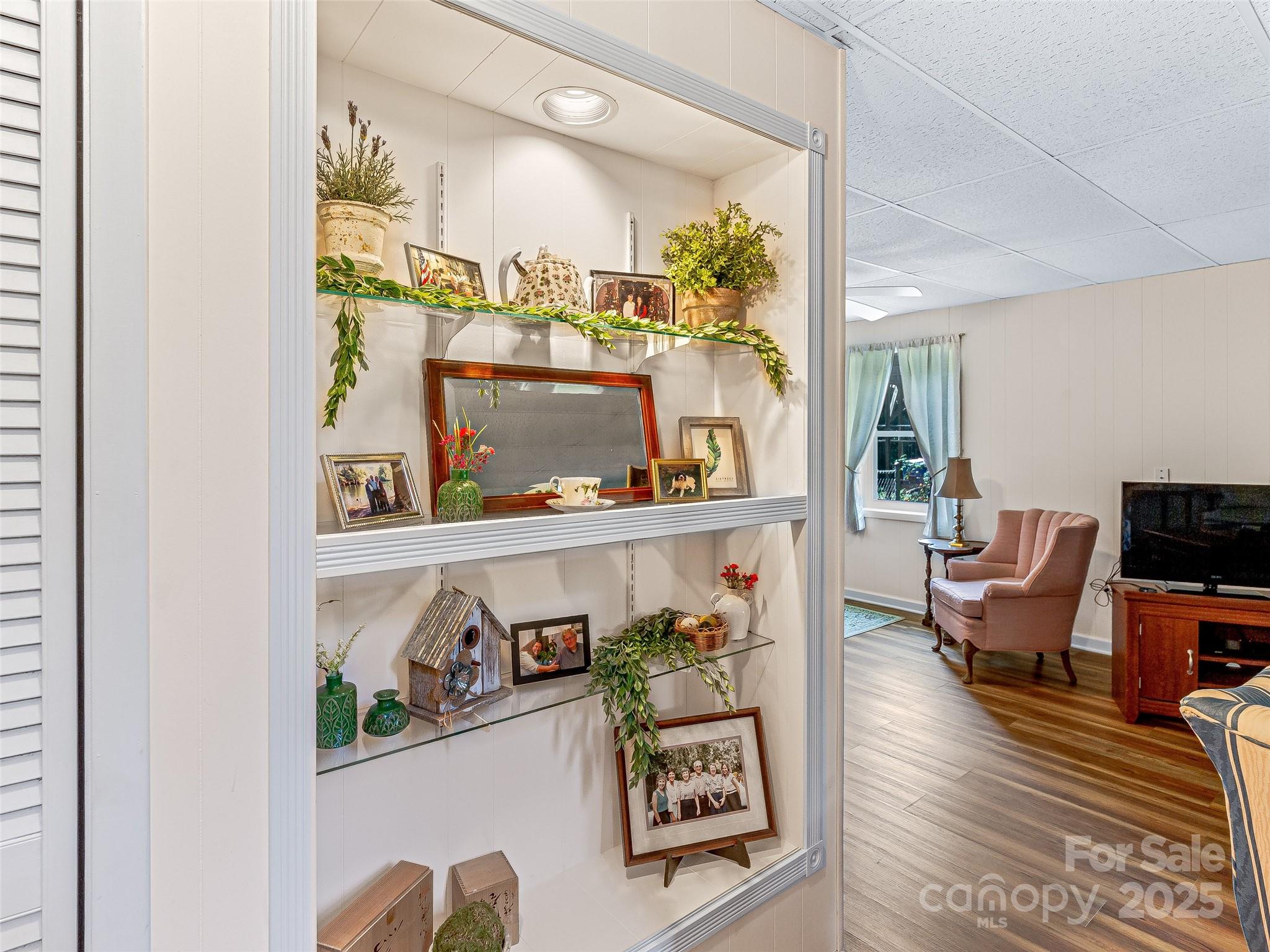 29 Tall Oaks Road Candler, NC 28715 - Photo 21 of 34 a living room with furniture and a floor to ceiling window