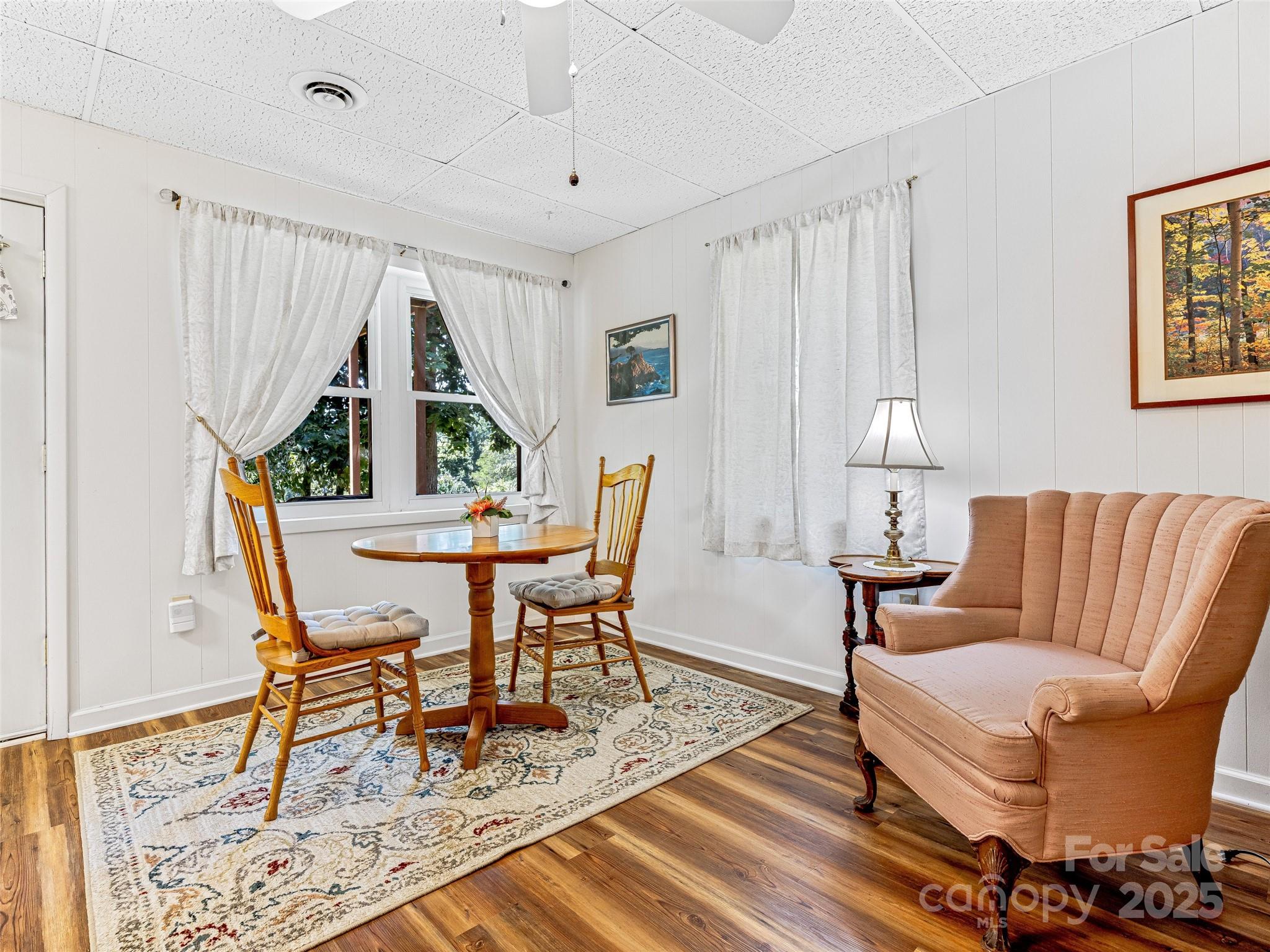 29 Tall Oaks Road Candler, NC 28715 - Photo 24 of 34 a living room with furniture and a wooden floor