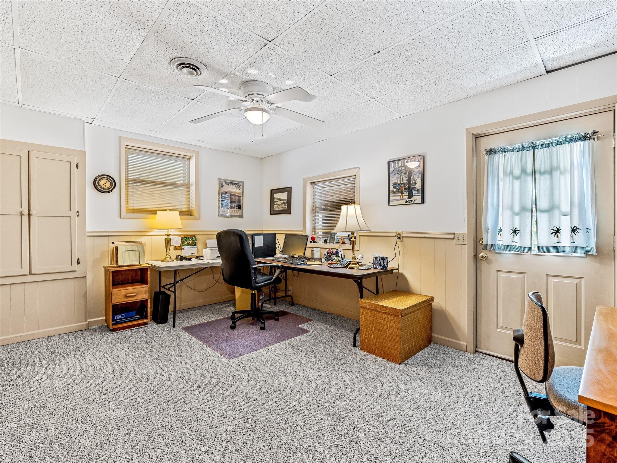 29 Tall Oaks Road Candler, NC 28715 - Photo 27 of 34 a view of a livingroom with workspace and a window
