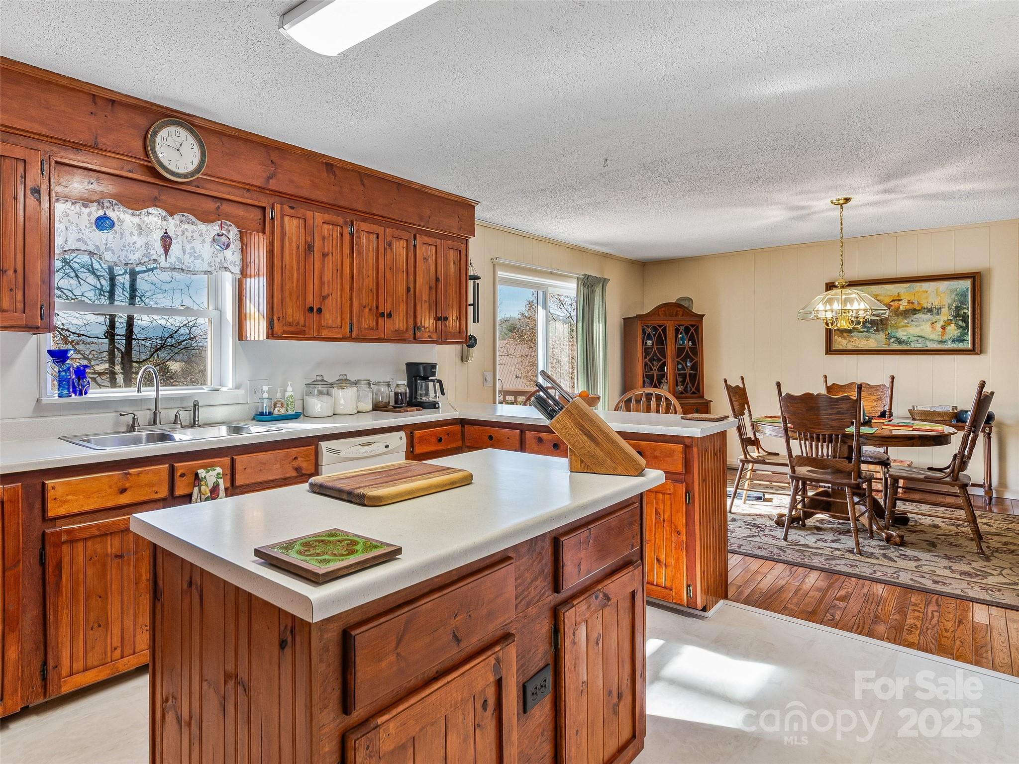 29 Tall Oaks Road Candler, NC 28715 - Photo 10 of 34 a kitchen with a sink a counter top space and living room view