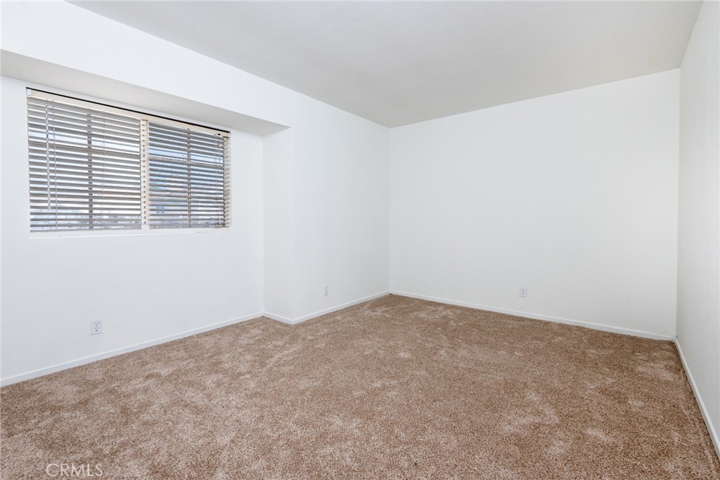 12306 Clover Road Pacoima, CA 91331 - Photo 12 of 18 an empty room with a window
