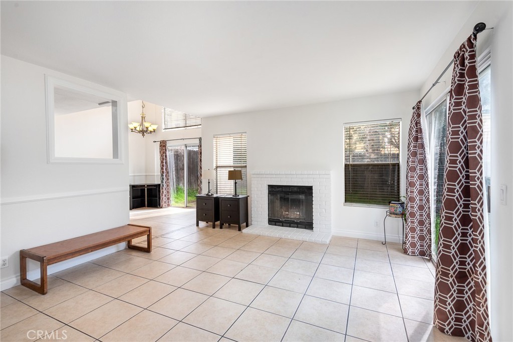 12306 Clover Road Pacoima, CA 91331 - Photo 3 of 18 a living room with furniture a fireplace and a potted plant