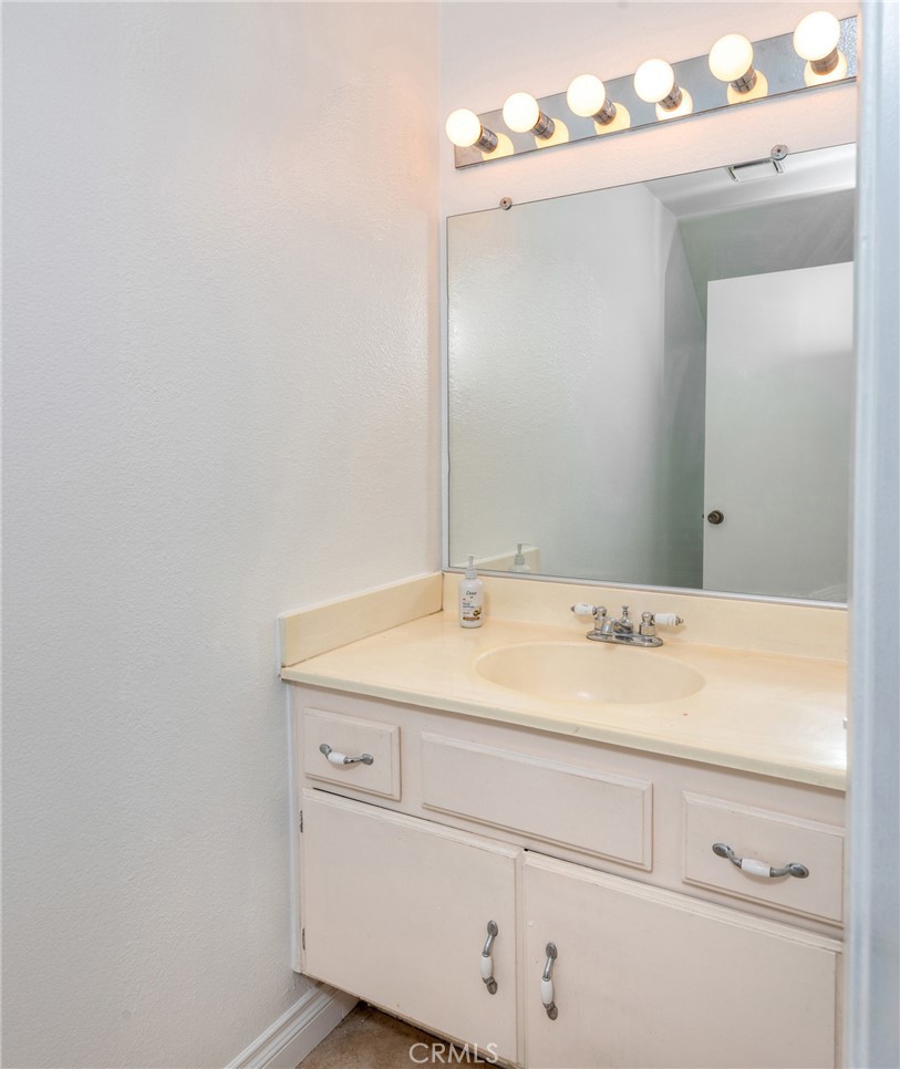 12306 Clover Road Pacoima, CA 91331 - Photo 6 of 18 a bathroom with a sink and vanity