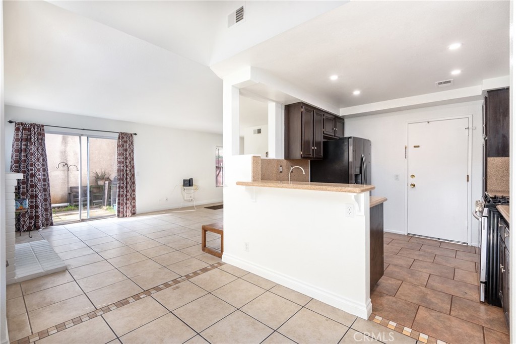 12306 Clover Road Pacoima, CA 91331 - Photo 10 of 18 a view of kitchen with furniture and refrigerator