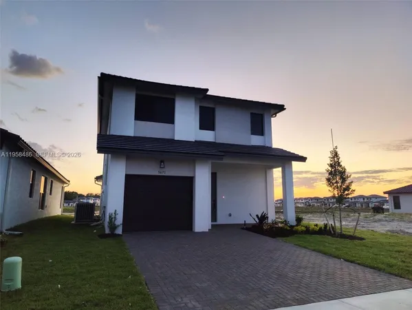 a house view with a garden space