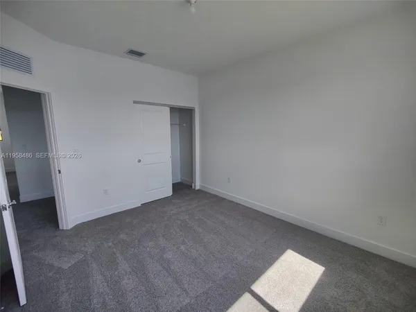 an empty room with a bench