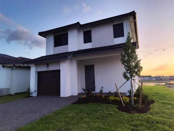 a house view with a backyard space