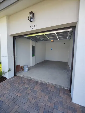 a white toilet sitting next to a white sink