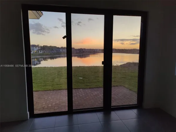 a view of a glass door and a porch