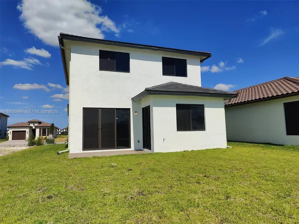 a front view of a house with yard