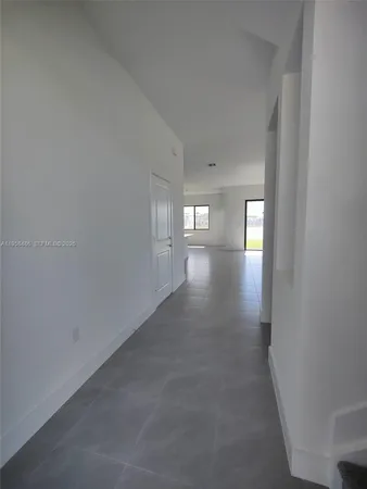 a view of empty room with windows