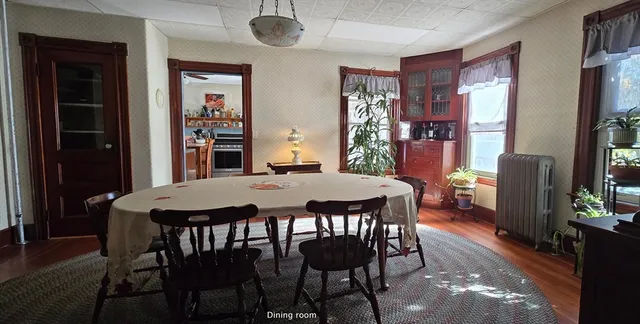 a dining room with furniture and window
