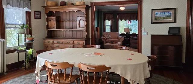 a dining room with furniture and window