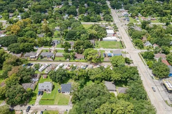 an aerial view of residential houses with outdoor space