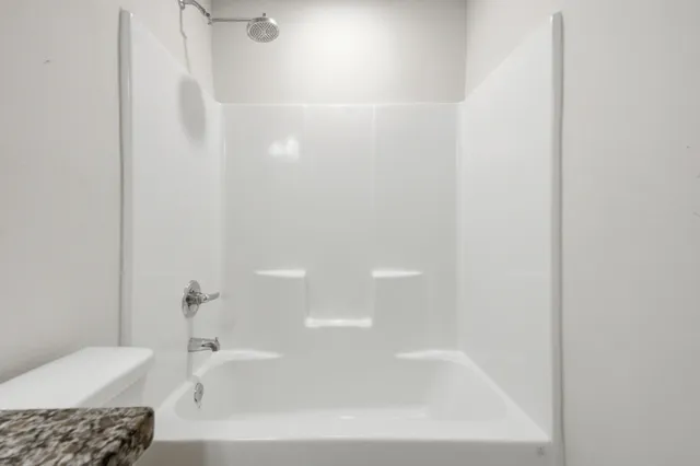 a front of a house with a garden