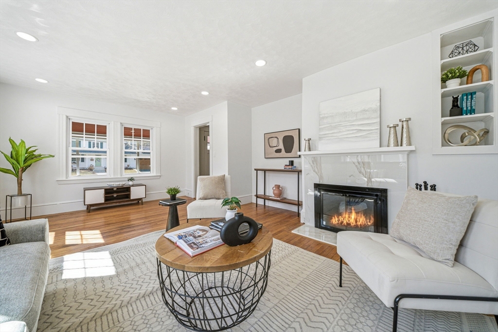 45 Marion Street Natick, MA 01760 - Photo 1 of 42 a living room with furniture and a fireplace