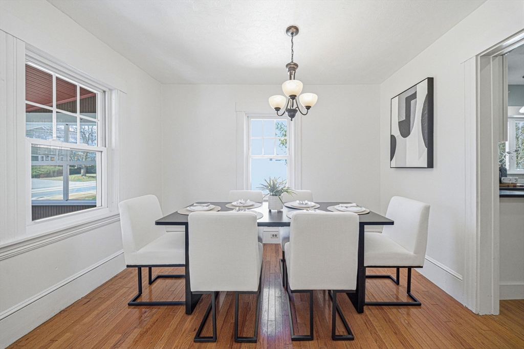 45 Marion Street Natick, MA 01760 - Photo 12 of 42 a view of a dining room with furniture wooden floor and chandelier