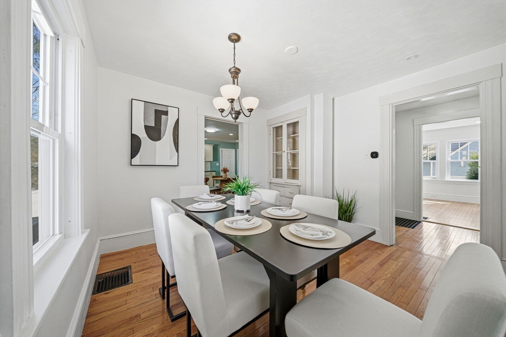 45 Marion Street Natick, MA 01760 - Photo 13 of 42 a view of a dining room with furniture and wooden floor