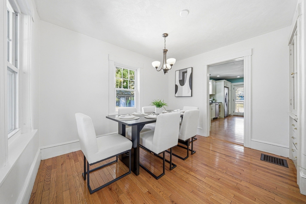 45 Marion Street Natick, MA 01760 - Photo 14 of 42 a view of a dining room with furniture and wooden floor
