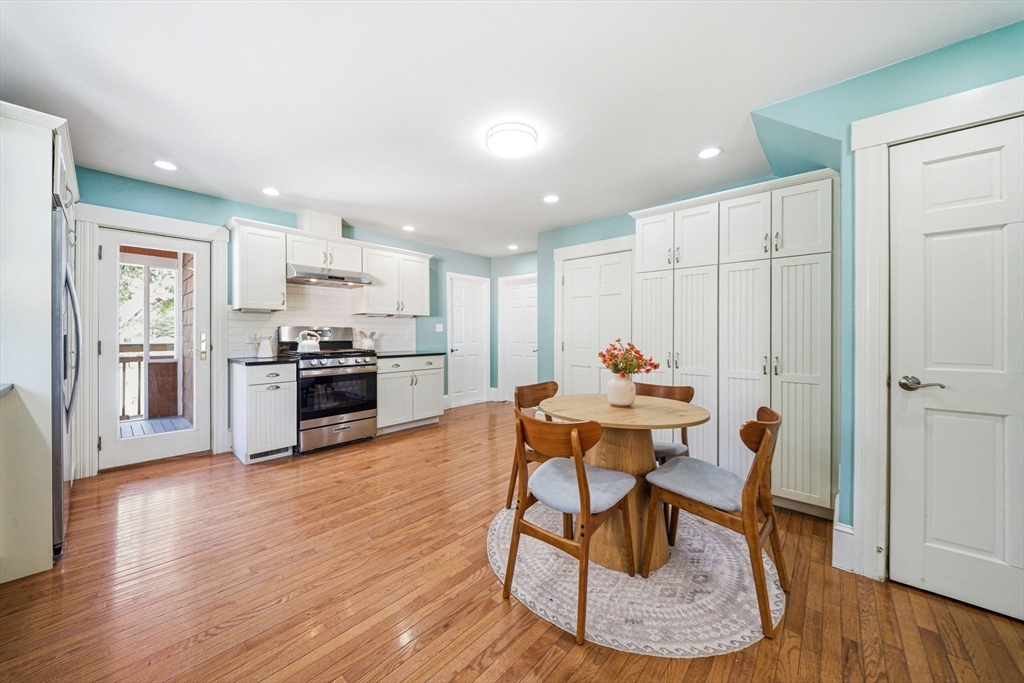45 Marion Street Natick, MA 01760 - Photo 20 of 42 a living room with stainless steel appliances kitchen island granite countertop furniture and wooden floor