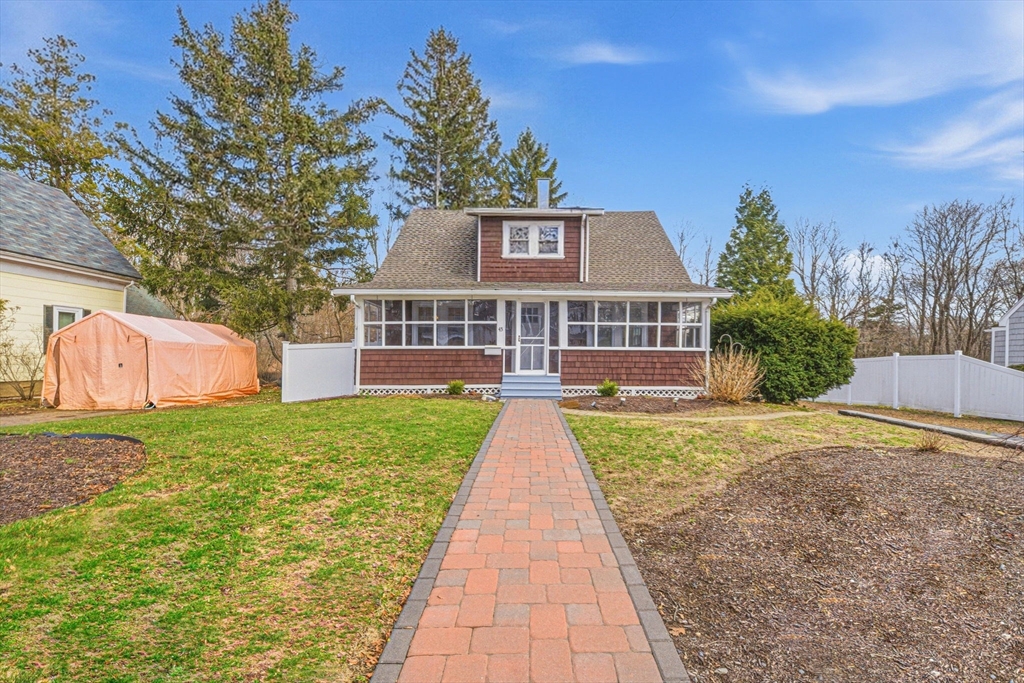 45 Marion Street Natick, MA 01760 - Photo 2 of 42 a front view of a house with yard and green space