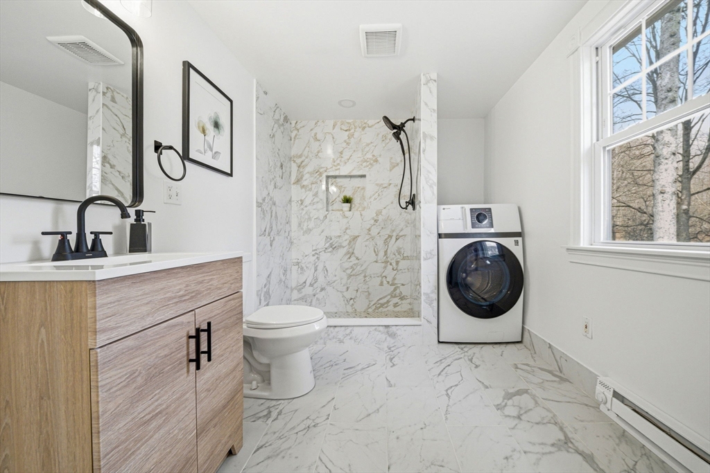 45 Marion Street Natick, MA 01760 - Photo 23 of 42 a bathroom with a toilet sink and shower