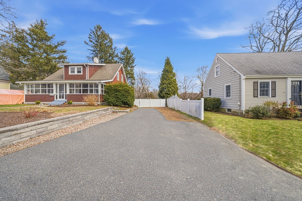 45 Marion Street Natick, MA 01760 - Photo 3 of 42 a front view of a house with a yard and garage