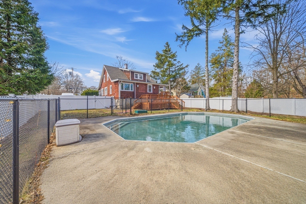 45 Marion Street Natick, MA 01760 - Photo 38 of 42 a view of a swimming pool with a patio