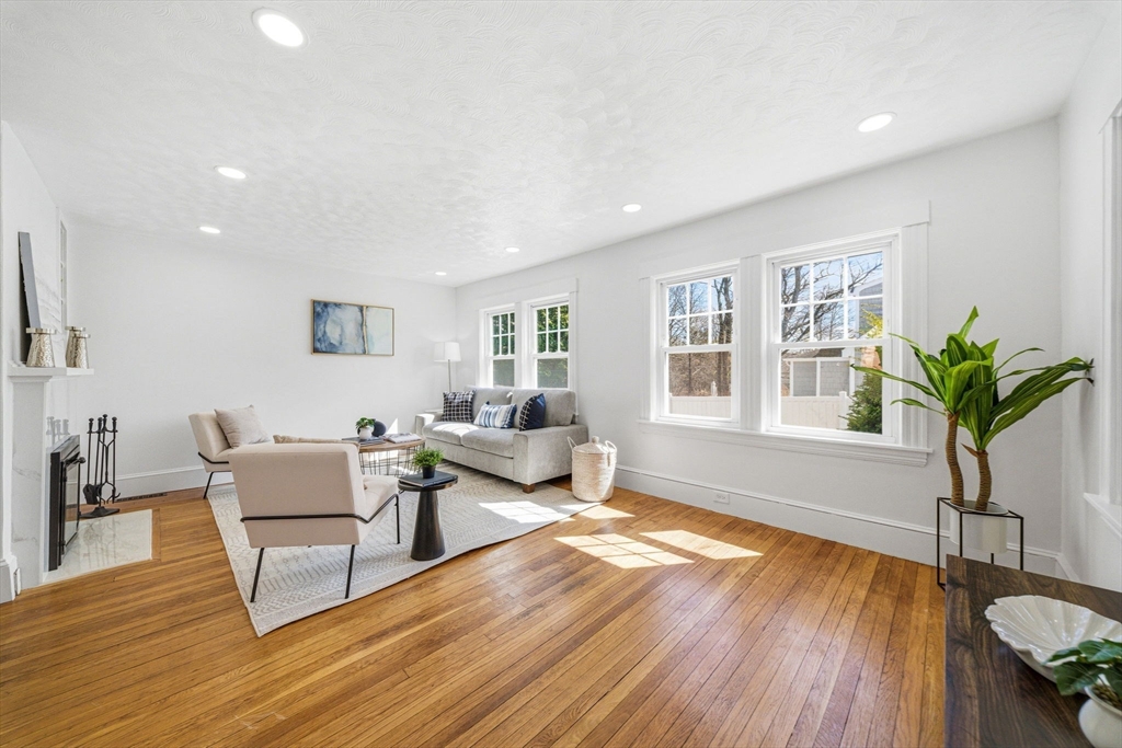 45 Marion Street Natick, MA 01760 - Photo 9 of 42 a living room with furniture and a potted plant with wooden floor