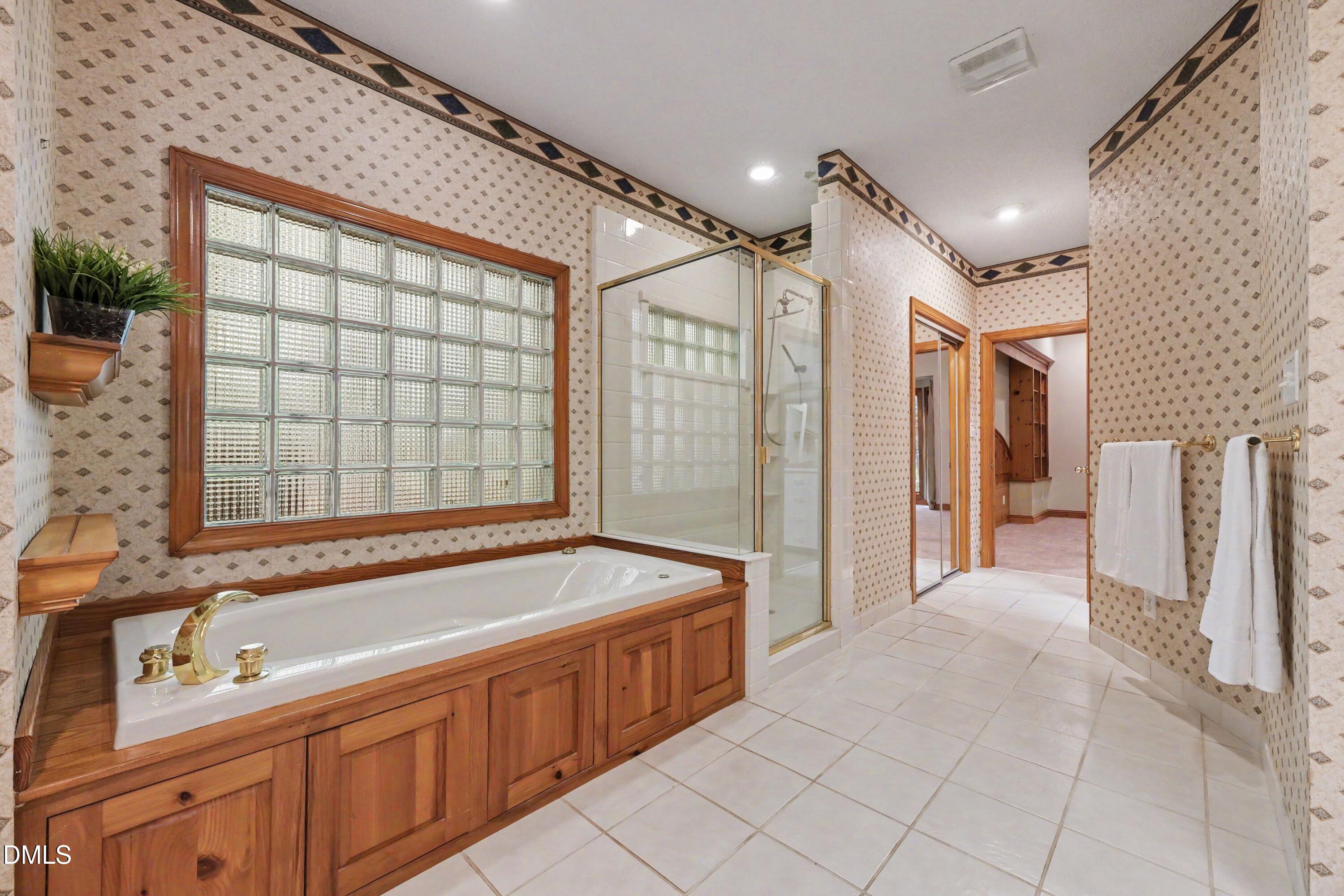 9921 Waterview Road Raleigh, NC 27615 - Photo 17 of 38 Downstairs Primary Bath