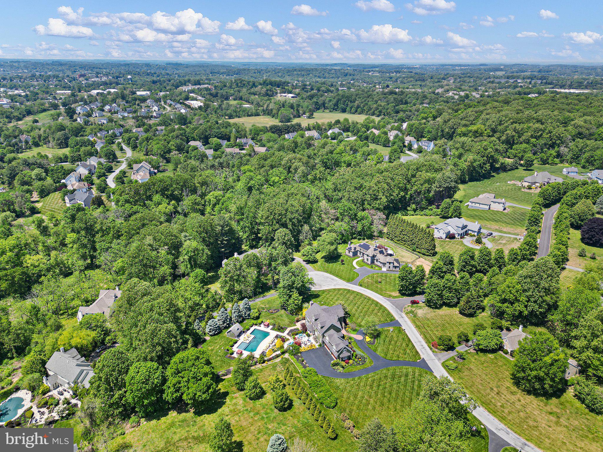 104 Indian Springs Road Kennett Square, PA 19348 - Photo 2 of 106 an aerial view of residential houses with outdoor space and trees
