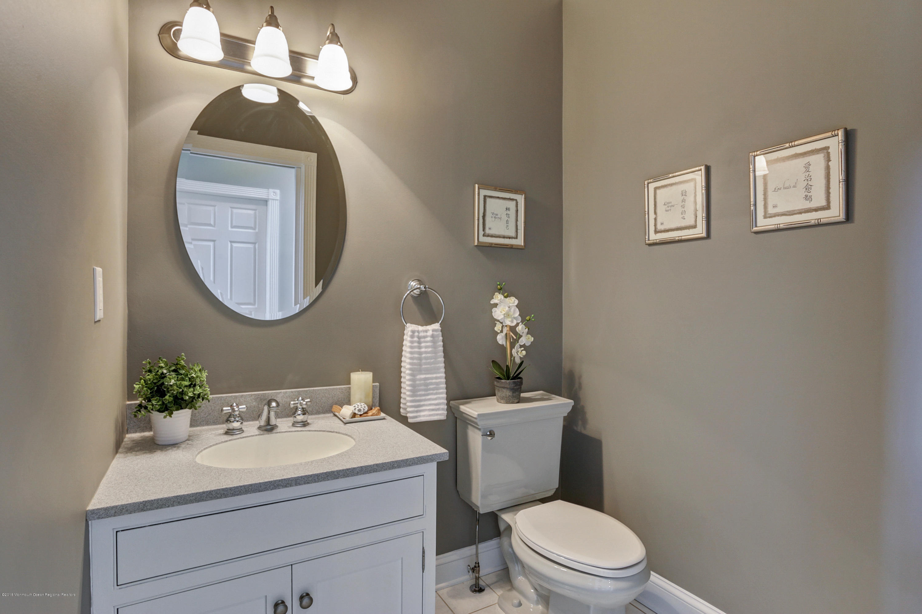 154 Lemon Road Farmingdale, NJ 07727 - Photo 14 of 43 a bathroom with a toilet a sink and mirror