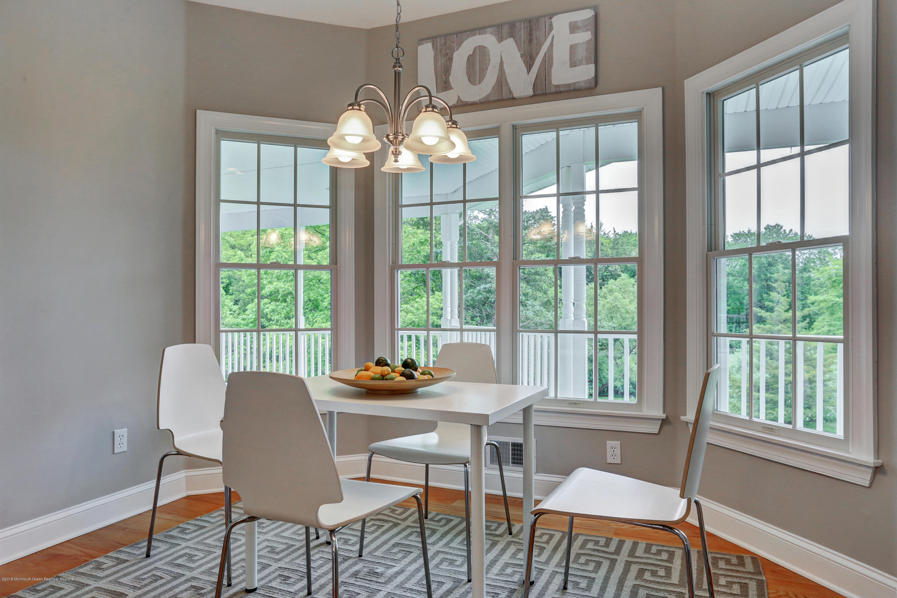 154 Lemon Road Farmingdale, NJ 07727 - Photo 22 of 43 a view of a dining room with furniture a chandelier and wooden floor